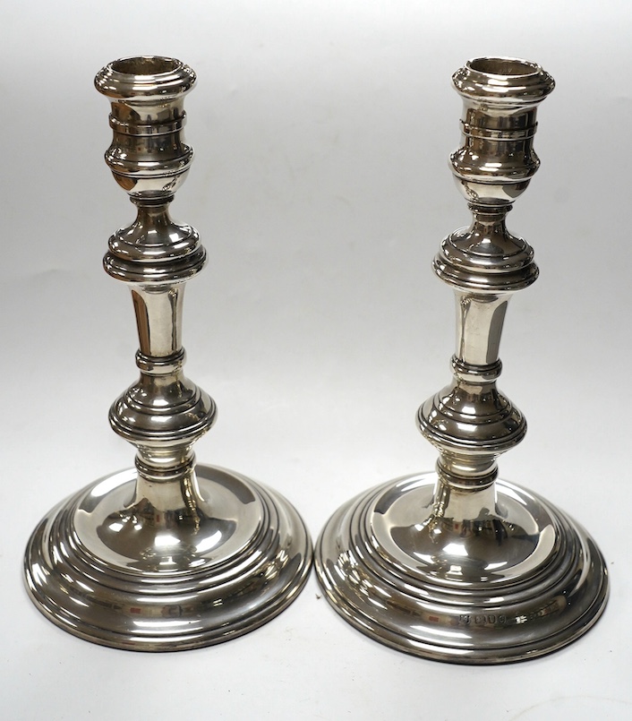 A pair of Elizabeth II silver candlesticks, with turned columns, London, 1958 (maker's marks rubbed, height 20.8cm, weighted. Condition - fair